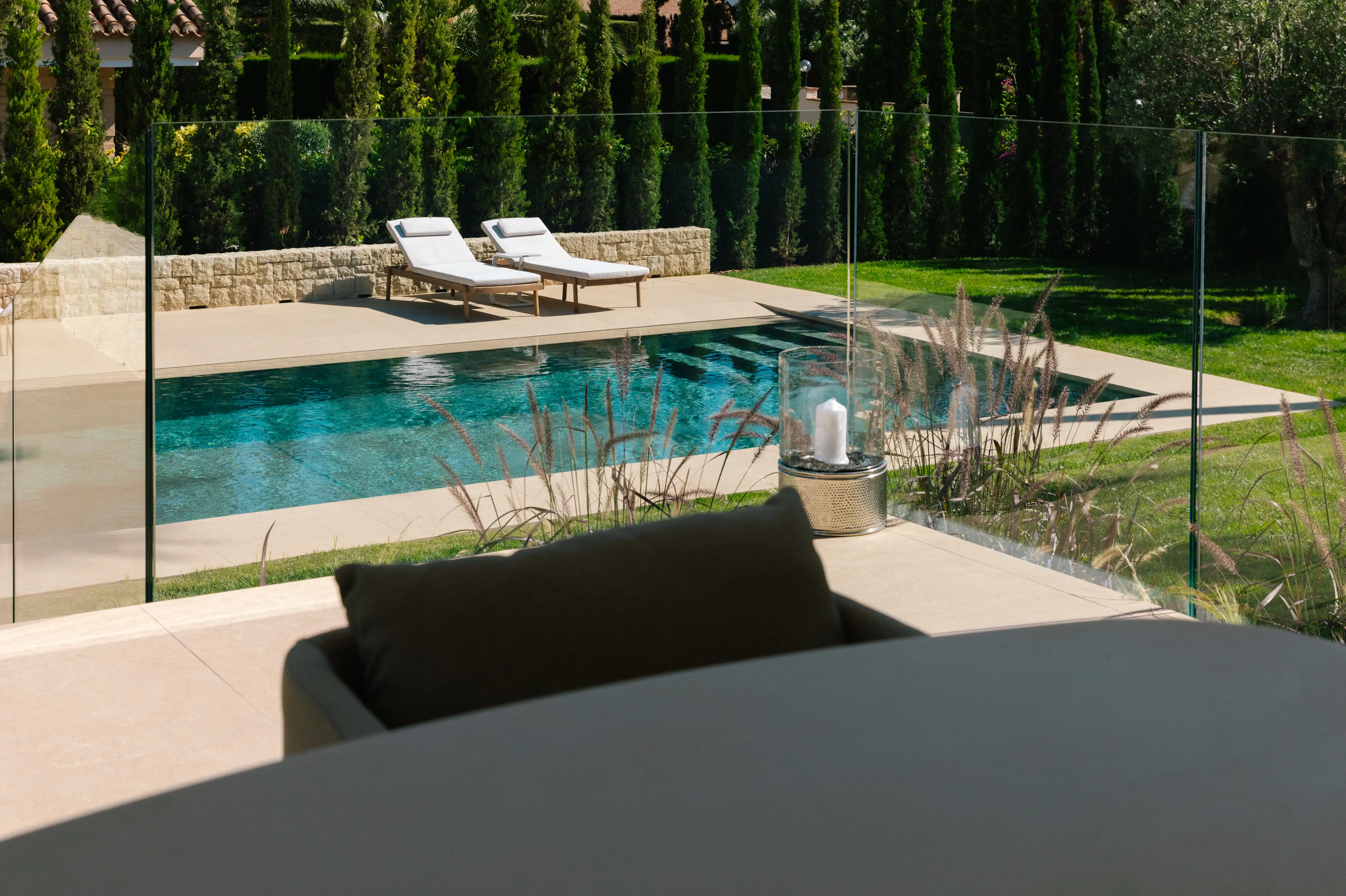 Outdoor terrace and pool area after reforma de villa in Campolivar Valencia image 1